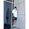 Calça Bermuda Casual com Estampa de Anjo Rezando, Tendência High Street Americana, para Homens e Mulheres, Nova Coleção de Verão, Solta e Versátil