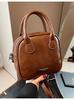 Bolso de mano pequeño vintage de otoño e invierno 2024, bolso de mano sencillo de color liso, bolso de hombro combinable, bolso cruzado.
