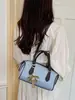 2026 Otoño Nuevo Estilo Coreano Retro Bolso de Hombro de Moda Más Vendido Color Sólido para Viajes Diarios Bolso Cruzado Tipo Cubo