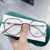 Montura de gafas redondas irregulares M2860 superior e inferior Marco óptico acabado con pegamento dorado mezclado lente plana anti-luz azul se puede combinar con gafas