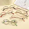 Gafas de alambre dorado estilo ojo de gato de alta gama refinado pícaro montura metálica anti-luz azul monturas de gafas retro europeas y americanas para mujer