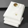 Jeans Elásticos Ajustados de Lujo Ligero Estilo Europeo de Gama Alta Blancos Resistentes al Agua para Hombre, Versión Gruesa para Otoño e Invierno 2026