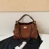 Bolso pequeño de cadena acolchado estilo Chanel con patrón de rombos, un bolso de axila vintage versátil y único, un bolso de mano delicado que se puede llevar en la mano o cruzar sobre el cuerpo