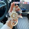 Llavero con colgante de bolso con lazo de camelia creativo, cadena de perlas de moda, llavero de coche coreano, círculo para mujer