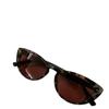 Gafas de sol con estampado de leopardo y ojo de gato retro de color rojo y red de libro pequeño europeo y americano para mujer, gafas de sol polarizadas de alta calidad con forma cóncava.
