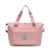 Bolsa deportiva portátil de gran capacidad transfronteriza para fitness, bolsa de viaje diagonal de corta distancia para mujer, bolsa de hombro repelente al agua para yoga, venta al por mayor