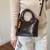 Bolso de hombro de nicho nuevo, retro, simple, versátil, moderno, estilo coreano de otoño, bolso de mano para el trabajo 2026 para mujer