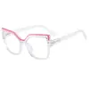 Gafas lisas de ojo de gato irregulares marco de resorte de PC anti luz azul color caramelo marco de gafas ópticas europeo y americano femenino