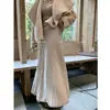 Elegante y suave falda de punto para mujer, nuevo estilo de invierno 2026, falda plisada de cintura alta adelgazante, falda de línea A con dobladillo ancho