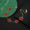 Traje de flor de cinco pétalos de acero inoxidable titanio acero pendientes de cinco pétalos pulsera collar al por mayor trébol de cinco hojas collar de flor de ciruelo juego de tres piezas