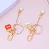 Mini Bolso Colgante Llavero Perla Amor Borla Colgante Niña Funda de Auriculares Decoración Accesorios DIY