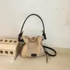 Elegante bolso de cubo con cordón para mujer, nueva colección otoño 2026, bolso tote retro y chic, bolso pequeño cruzado de color liso