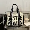 Otoño e Invierno 2025 Nuevo Estilo Color de Contraste Estampado de Letras Correa de Hombro Colorida Bolso de Lona Casual para Mujer Bolso de Hombro Único Bolso Cruzado