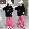 Camiseta de Manga Corta para Niña con Estampado de Lazo Top Nuevo 2026 Estilosa Ropa de Verano para Niños Conjunto Estilo Coreano Moderno