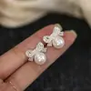 Aretes de encaje con moño y perlas, un diseño único y elegante con circonita cúbica, versátiles y lujosos, una colección de aretes nueva y de alta gama.