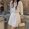 Roupas femininas Dongdaemun coreanas, vestido camisa plissado elegante de lapela única estilo coreano outono vintage saia curta