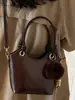 Bolso bandolera tipo cubo retro simple de moda coreana Bolso de hombro de moda nuevo Invierno 2025 Bolso cruzado de nicho para mujer