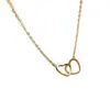 Colgante de Doble Anillo de Corazón Hueco Simple y Elegante Cadena para Clavícula para Mujeres Moda Tendencia Collar Entrelazado con Forma de Corazón Venta al por Mayor