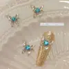 Joyería de uñas nueva de网红 aleación mariposa líquida mariposa plateada estéreo cuadrado de diamante decoración de uñas de diamante al por mayor