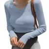 Camiseta redonda popular europea y americana para mujer, top casual de alta gama, color liso, diseño acanalado elástico, camiseta de manga larga para usar por fuera