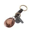 Accesorios creativos para colgar de aleación de cuero DIY llavero de cuero llavero joyería de piel de vaca europea y americana