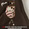 Pulseira de gato KT com estampa de leopardo adequada para capa de celular Apple 18pm iPhone 17 Outono/Inverno 16 Fofa 14 Silicone 15 Desenho Animado