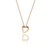 Collar de corazón hueco para mujer, acero de titanio, oro rosa, red, cadena de clavícula en forma de corazón rojo, colgante geométrico que combina con todo, pequeño y exquisito