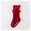 Calcetines nuevos de color liso a rayas hasta la rodilla para niños y niñas, algodón poliéster antideslizantes con parte superior de burbujas, calcetines de media pantorrilla con lazo para bebé al por mayor