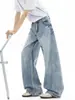 Jeans de estilo americano lavados azul claro con dobladillo curvo para hombre y mujer, pantalones casuales de alta costura para otoño 2026, pantalones anchos holgados y fluidos