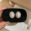 Elegante HerederaEstilo Fresco Bolso de Lunares Plateados Arete Arete Único Mujer 2026 Aretes Súper Hermosos