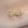 Aretes para Mujer Transfronterizos Estrella y Luna Rotación Viajero Viento Frío Aretes de Zircón Elegantes Diseño de Nicho Sentido Viento Ins