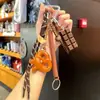 Miu Anillo de Llavero de Pan con Agua Alcalina Resina Pan Colgante de Llavero de Bolsa de Chocolate Regalo de Graduación