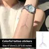 Adesivo de tatuagem de cauda de sereia iridescente, com design de cauda de peixe em degradê e estrelas, em formato vertical, adequado para pulsos, antebraços e clavículas, e à prova d'água