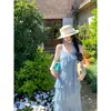 Vestido camisola azul con cuello en V y lunares estilo vacacional para mujer, elegante vestido largo de verano ajustado con volantes, transfronterizo