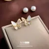 Pendientes de Mariposa y Perla con Circonita Retro Estilo Francés, Elegantes y con Estilo, un Diseño de Pendiente Versátil de Dos Vías, Lujo Ligero, Joyería de Oreja Dulce y Versátil