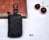 Nova moda primeira camada cowhide em relevo carro controle remoto caso chave couro carro unisex fábrica atacado