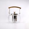 Tetera de vidrio de borosilicato al por mayor transfronteriza con forro interior de acero inoxidable engrosado resistente al calor, mango de cobre, tetera tipo olla con asa de viga, tapa para té