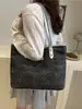 Bolsa Jeans para Mulheres 2025 Nova Tendência Moda Nicho Simples Ombro Transversal Versátil Bolsa Tote Exportação