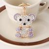 Llavero de metal con colgante de oso y bolsa de diamantes creativo, accesorio para coche, bonito regalo pequeño al por mayor
