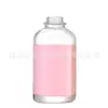 Botella premium transparente de vidrio para desinfectante de manos, botella de vidrio vacía de estilo nórdico de lujo ligero para dispensar artículos de tocador en hoteles y alojamientos.