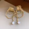 Brincos Pingente Redondo de Pérola Geométrica Agulha de Prata Moda Versátil para o Trabalho Brincos de Luxo Leve High-End Atacado para Mulheres