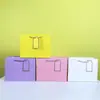 Bolsa Horizontal Cartão Branco Embossado Bolsa de Mensageiro Saco de Papel para Embalagem Atacado Pontual Bolsa de Compras de Papel Embossado Onda Bolsa de Presente com Cartão Pendurado