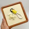 Llavero de Hazte Rico Inmediatamente Zodiaco de Dibujos Animados Llave de Coche Colgante de Pony Dorado Versátil para Pareja Adorno Lindo