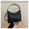 Bolso de verano para mujer, nuevo estilo transfronterizo, dulce y elegante, con patrón tejido en relieve, versátil para el trabajo, se puede usar como bolso de hombro, bolso cruzado o bolso de mano