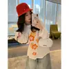 Camiseta floral de manga longa estilo coreano para mulheres, design ins de algodão puro para outono, corte casual solto, top interno modelador