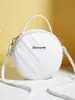 2025 Nova Moda Elegante Exquisito Elegante Em Relevo Forma de V Cor Sólida Ombro Único Transversal Bolsa Pequena Redonda Fábrica Atacado
