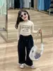 Otoño 2024 nueva ropa infantil coreana para niñas estilo chica popular camiseta corta con orejas de madera pantalones negros pantalones rectos