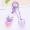 Nuevo llavero colgante de acrílico colorido de amor accesorios frescos de corazón de melocotón burbuja decoración de funda de auriculares bolsa