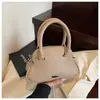 Bolsas Transfronteiriças 2025 Primavera e Verão Novo Nicho Doce e Fofo Bolsa de Concha Bolsa de Ombro Fashion Bolsa de Bowling Portátil