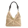 Bolsa de palha estilo coreano para o verão para mulheres, perfeita para férias na praia, apresentando um design vazado, estilo sacola de ombro único e alça trançada